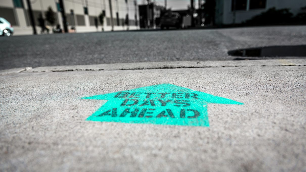 The words "Better Days Ahead" printed on the pavement.